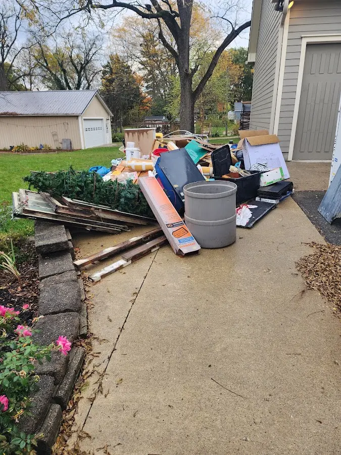 Dumpster being loaded with debris for Roofing Dumpster Rental in Alliance